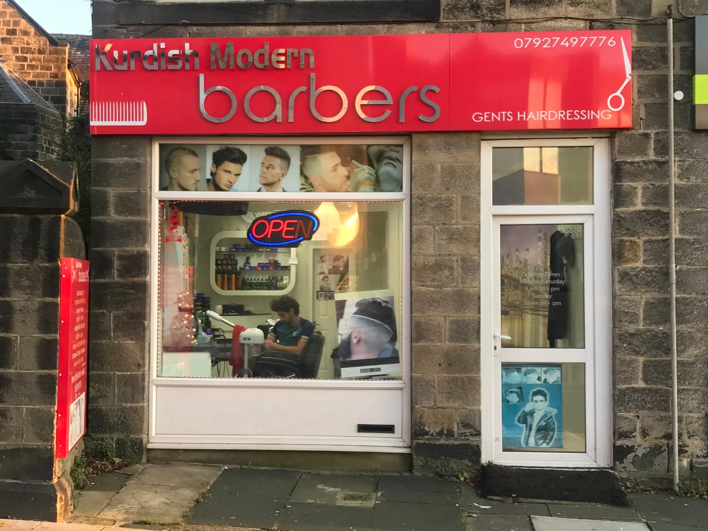 The red Kurdish Modern Barbers shopfront at 106 Town Street