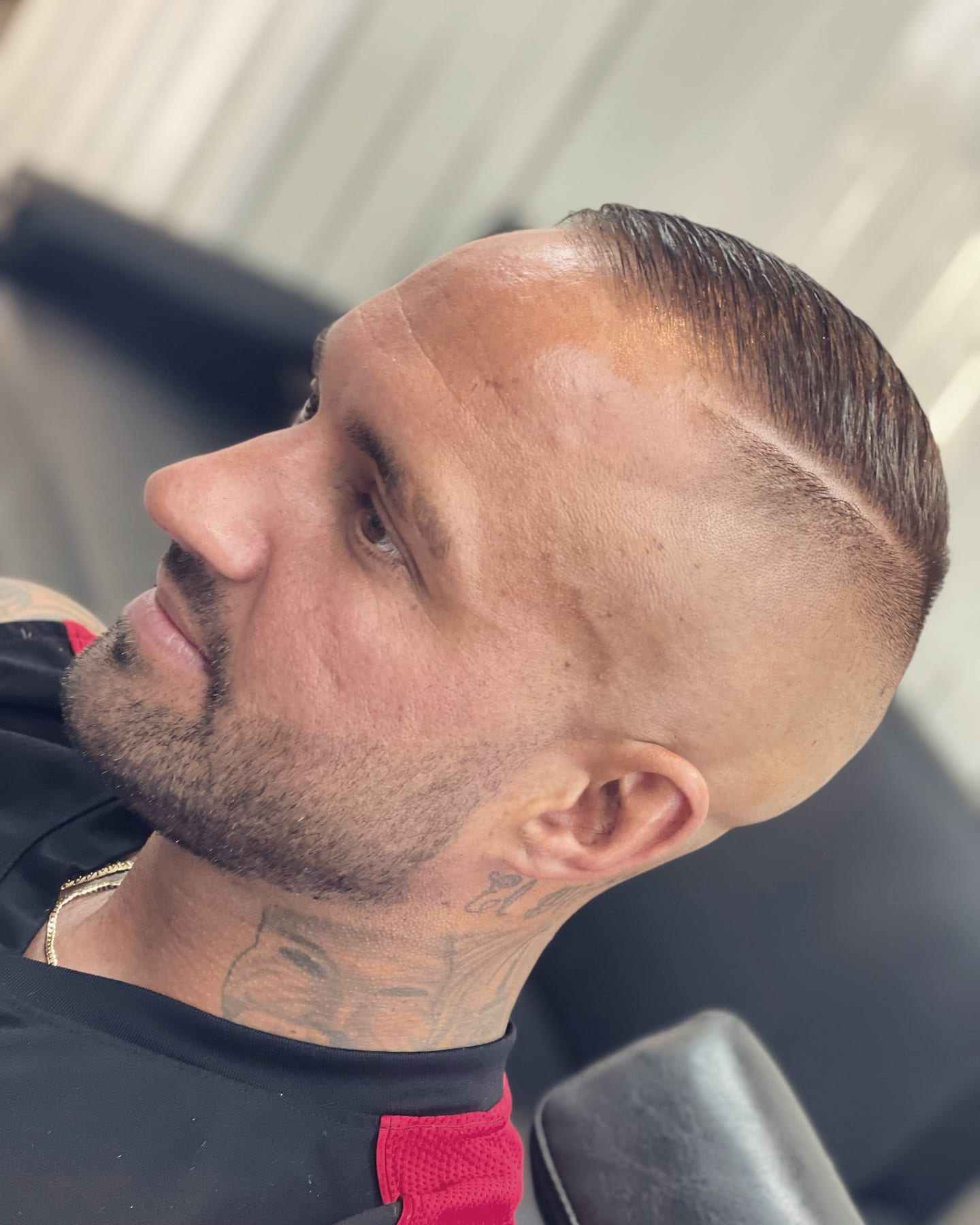 Finished side-parted haircut with a neatly shaped beard